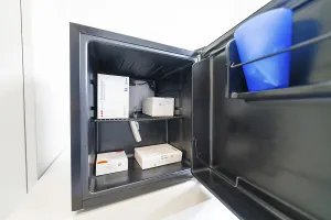 Open freezer with several medicine boxes in the office