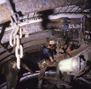 In operation in the roadway with the miners at hard work
