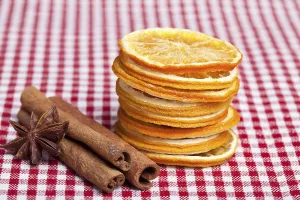 Orange, cinnamon and aniseed on a chequered cloth