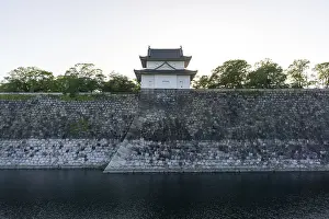Osaka castle watch tower viewed during late afternoon during sunset hours