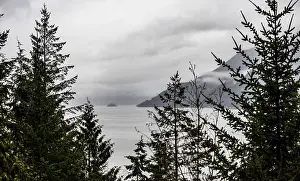 Framed Print : Overcast skies above a scenic view of a lake with islands