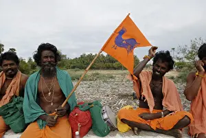 Pada yatra or foot pilgrimage holding flag with cock emblem during Vaikasi