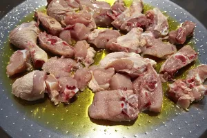 Paella from Spain recipe fry chicken and rabbit second step