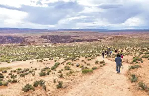 PAGE, ARIZONA - MAY 25: Hikers at Horseshoe Bend on May 25