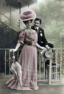 Pair flirts, fashionably dressed