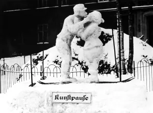 Pair of snow, snowman and snow woman kissing