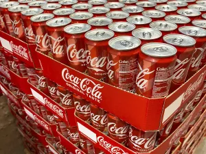 Pallet with cans drinking cans beverage cans of soft drink Coca-Cola Coke Coca Cola