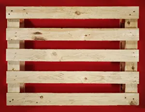 Pallet on red surface