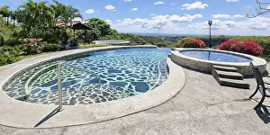 Panama, Los Molinos, infinity pool overlooking the volcano valley on a sunny day