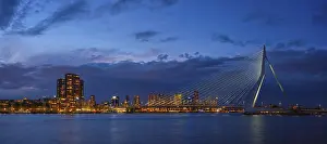 Panorama of Erasmus Bridge (Erasmusbrug) and Rotterdam skyline illuminated at night