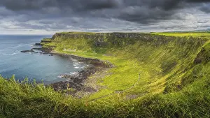 Panorama of Giants Causeway with dramatic light and sky