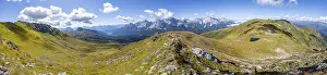 Panorama, hiking trail between green mountain meadows on a mountain ridge