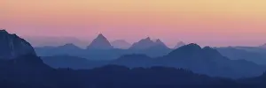Panorama hilly landscape with mountains Kleiner and Grosser Mythen after sunset