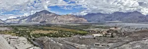 Panorama of Nubra valley in Himalayas with giant Buddha statue in Diskit