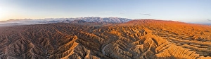 Panorama, riverbed runs through a landscape of eroded hills