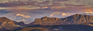 Panorama shot, Snowy mountains and cloudy sky at sunset