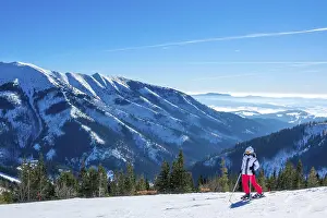 Panorama of snowy mountains in a winter sunny day