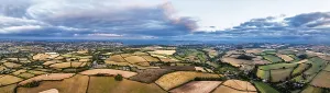 Panorama of Sunset over Fields and Farms from a drone