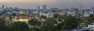 Panorama after sunset from Golden Mount to Wat Ratchanatdaram Worawihan and the skyline of Bangkok