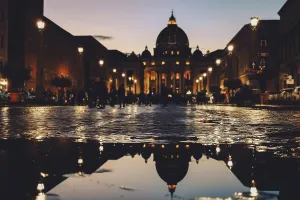 Panoramic night view of St Peter's Basilica with beautiful reflection in Vatican City