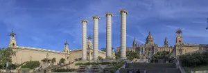 Panoramic photo with the 4 white stone columns of Les Quatre Columnes