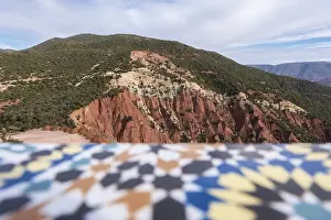 Panoramic view of the Atlas Mountains in Morocco and its curved roads to cross them
