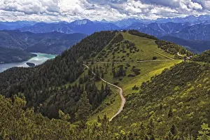 Framed Print : Panoramic view from the Herzogstand of wooded mountains and a winding hiking trail