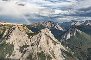 Panoramic view on mountain landscape with rainbow