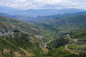 Framed Print : Panoramic view of mountains, green landscape with winding roads