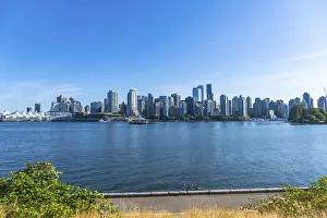 Framed Print : Panoramic view of vancouver's modern skyline rising above the calm pacific ocean on a sunny day Framed Print : Panoramic view of vancouver's modern skyline rising above the calm pacific ocean on a sunny day