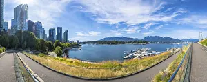 Framed Print : Panoramic view of vancouver's modern skyline rising above a picturesque waterfront