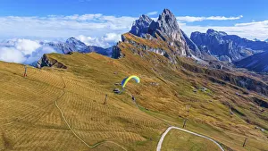 Paraglider over alpine meadows