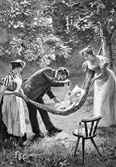 Parents with baby in garden, hammock