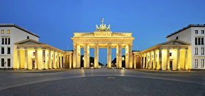 Pariser Platz with illuminated Brandenburg Gate at dawn