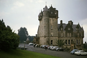 Parked cars at Belfast Castle, completed in 1870, historic Victorian building, Belfast, Northern Ireland, UK 1960s