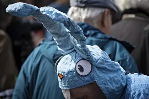 A participant of the Easter March rally on the Romerberg in Frankfurt am Main dressed up as an Easter bunny