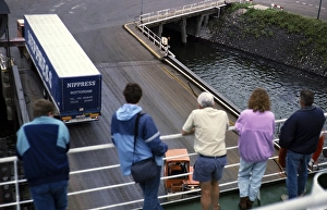 Passengers watching cargo being loaded onto the ferry Norsun, North Sea Ferries, harbour of Rotterdam, Netherlands, around 1987