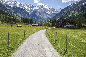 Path in Stillachtal, behind mountains of the Allgaeu Alps