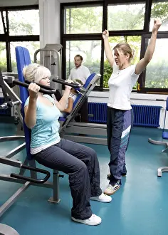 Patients during muscle strength training on various machines in the training room
