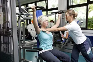 Patients during muscle strength training on various machines in the training room