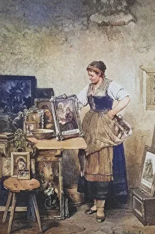 Patron saints, woman with framed pictures of various saints