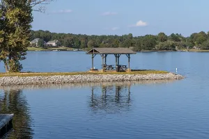 Pavilion with picnic tables on a peninsula at Beech Lake reservoir in Lexington