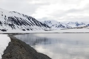 Pebble beach in a bay, mountain range