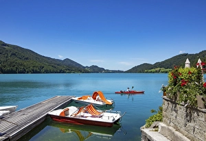 Pedal boats at the landing stage on the lake promenade