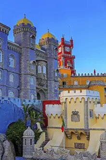 Pena castle red clock tower and blue mosaic towers in Sintra