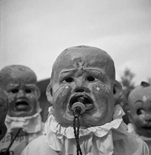 People with baby masks, carnival