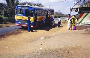 People boarding a local bus on the route between Area 12 and Lilongwe market, Malawi, Southern Africa 1989, Africa
