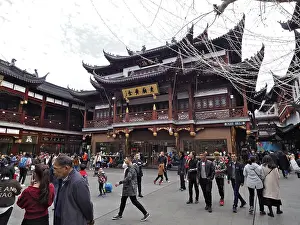 Framed Print : People in front of a building with traditional Chinese architecture Framed Print : People in front of a building with traditional Chinese architecture