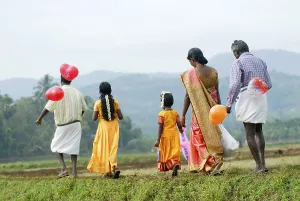People carrying balloons for festival