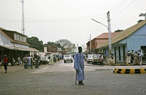 People and cars in a busy street in the central business district, Banjul, Gambia, Africa, 1978, Africa